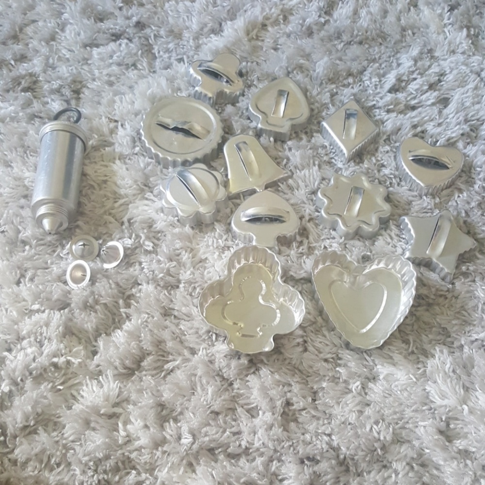 Metal cookie cutters, tins and icing tub with tips